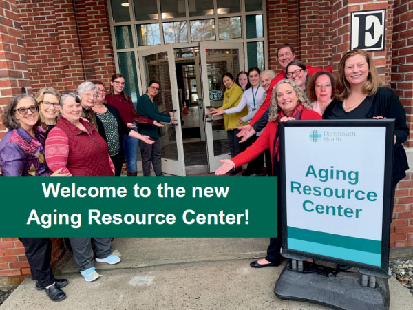 The staff of the Aging Resource Center, standing at the Center's entrancing, welcoming all.